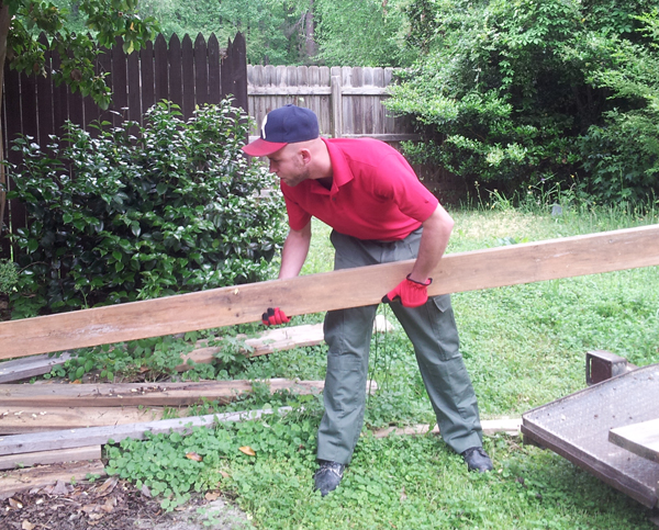 The Junk Squad removing old wood and construction material from an Atlanta residential junk removal job.